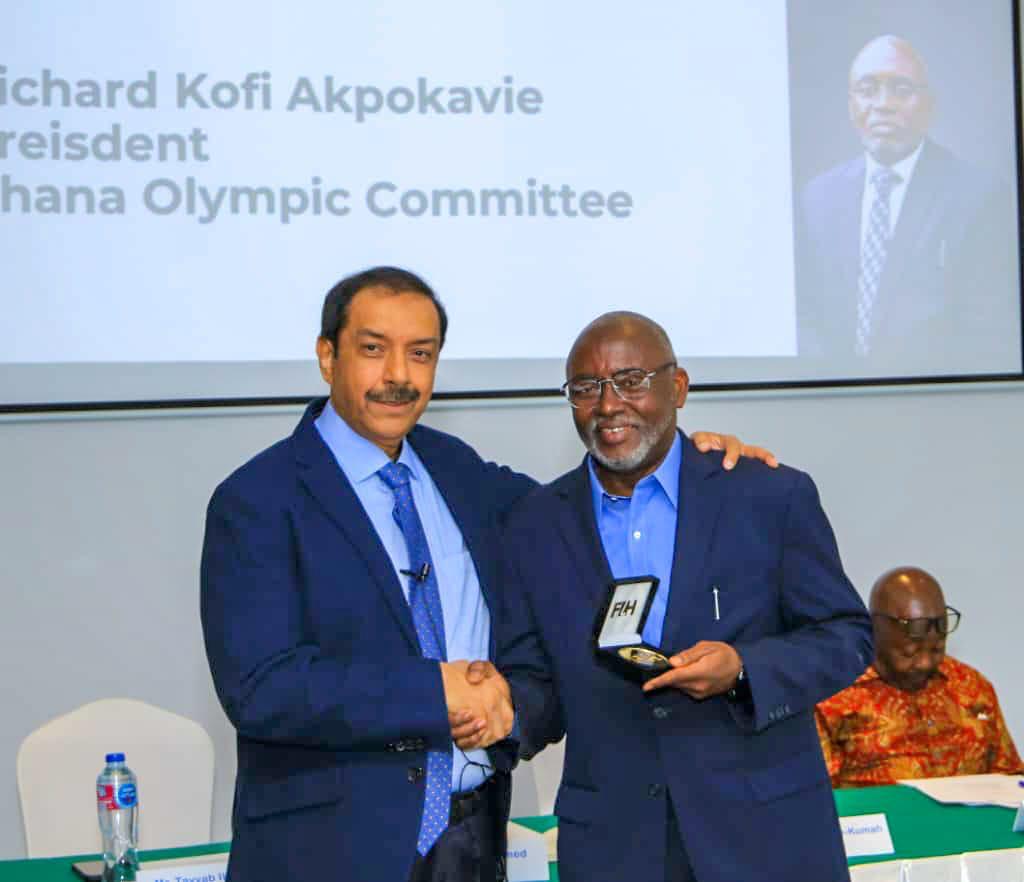 RICHARD AKPOKAVIE ESQ,  HONORED BY THE INTERNATIONAL HOCKEY FEDERATION.